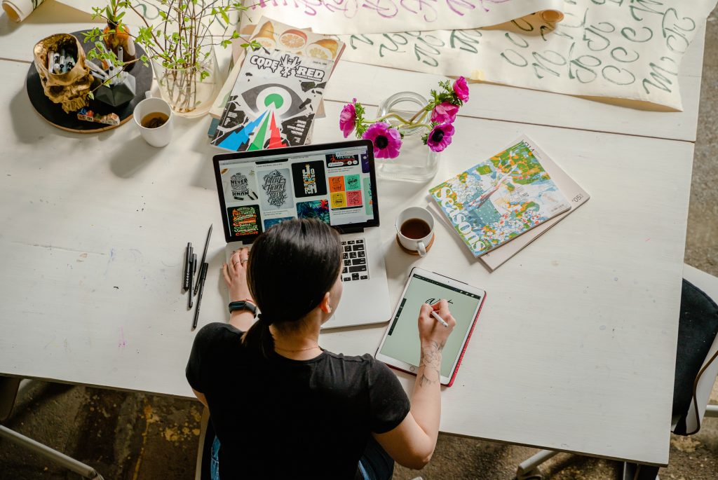 
Photo by Antoni Shkraba: https://www.pexels.com/photo/photo-of-woman-writing-on-tablet-computer-while-using-laptop-4348401/