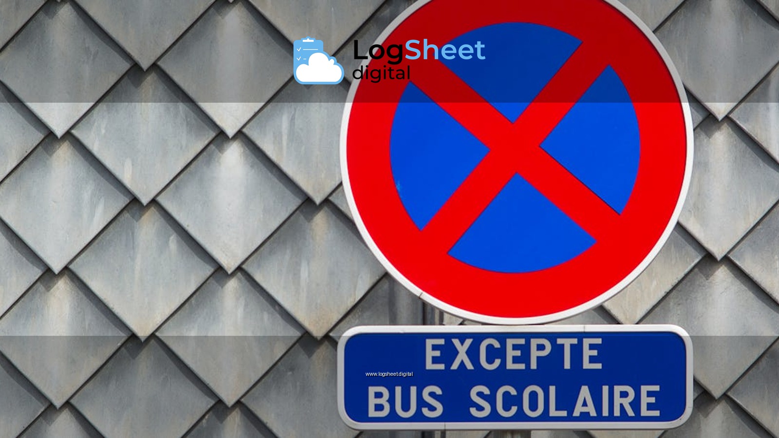 Close-up of a French no parking sign with a school bus exception on a tiled building facade.