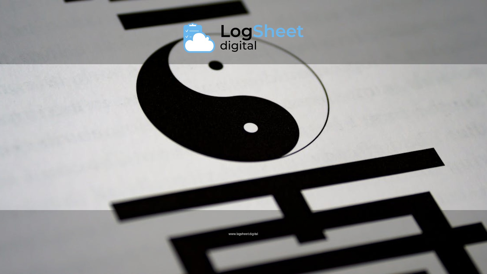 Artistic close-up of yin-yang symbol with Chinese calligraphy on paper.