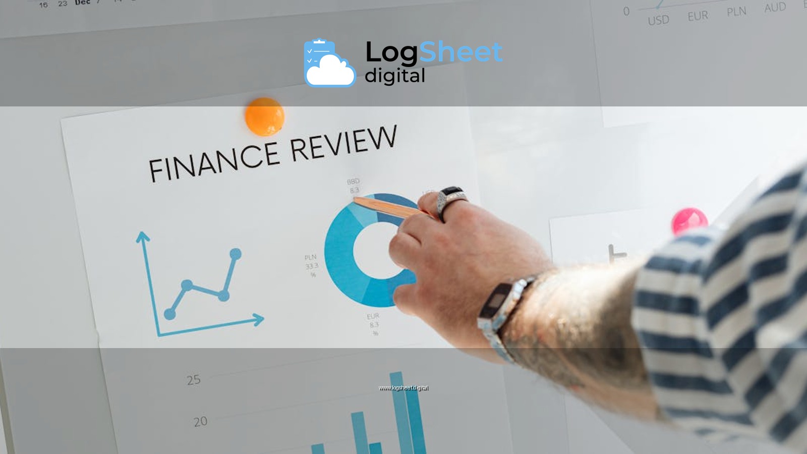Close-up of a hand pointing to financial charts during a business review.
