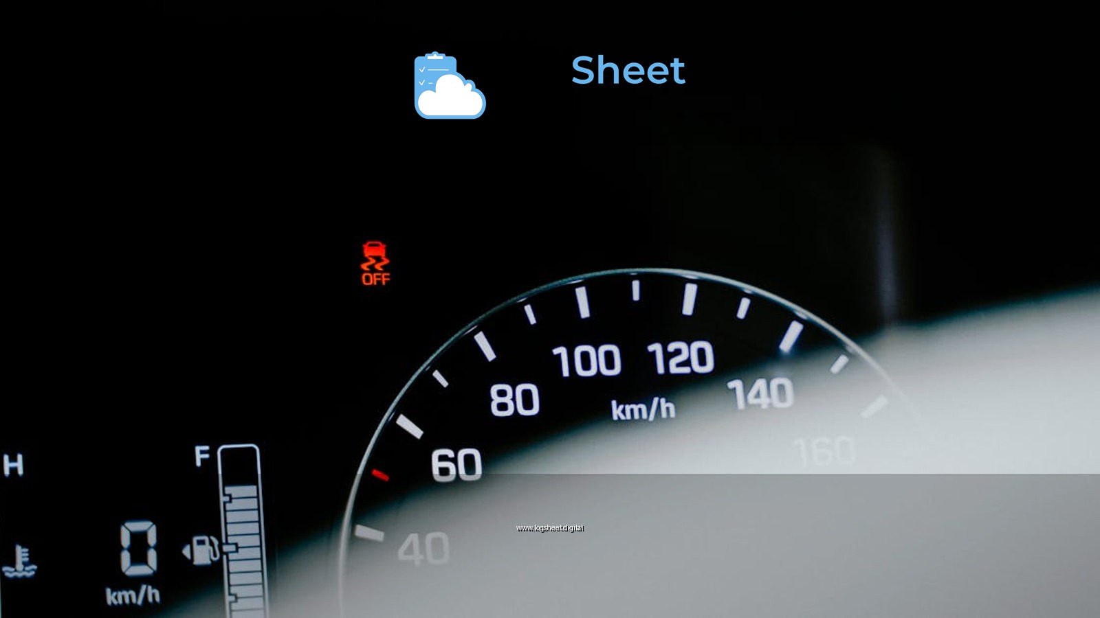 Detailed close-up of a car speedometer displaying a digital reading and warning light.