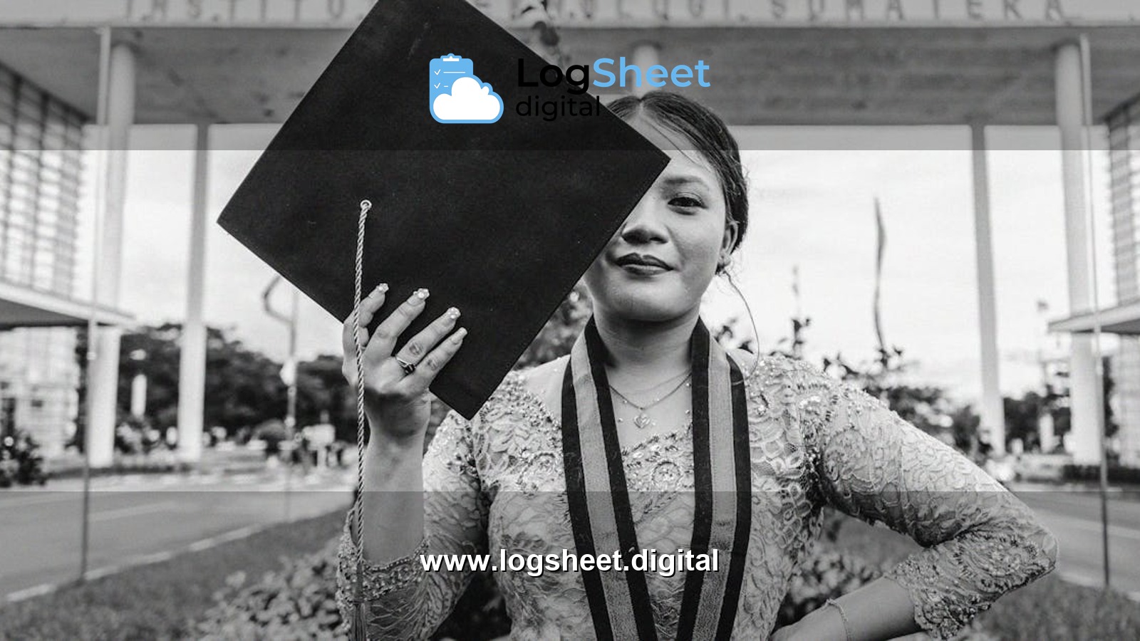 Black and white portrait of a graduate holding mortarboard at Institut Teknologi Sumatera.