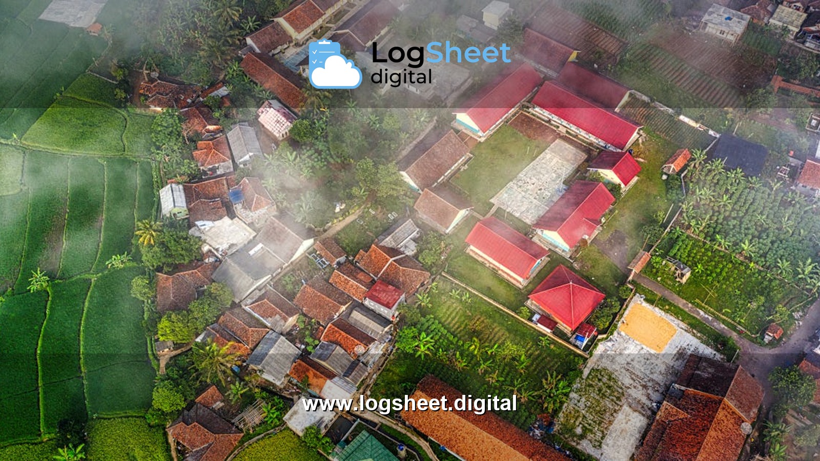 Aerial view of a West Java village with lush fields and red-roofed houses.