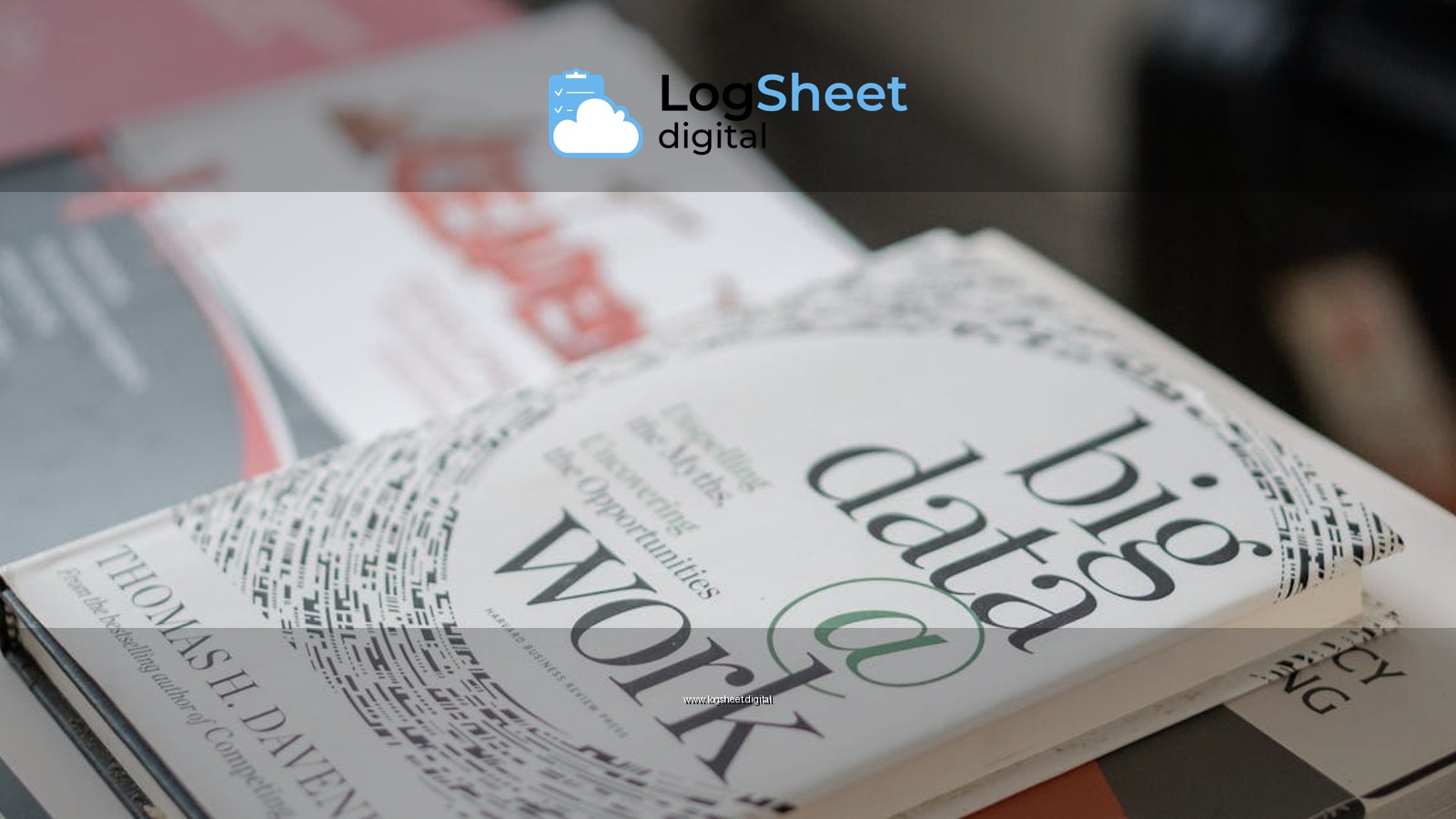 Close-up of books on data analytics and business strategies on a desk.