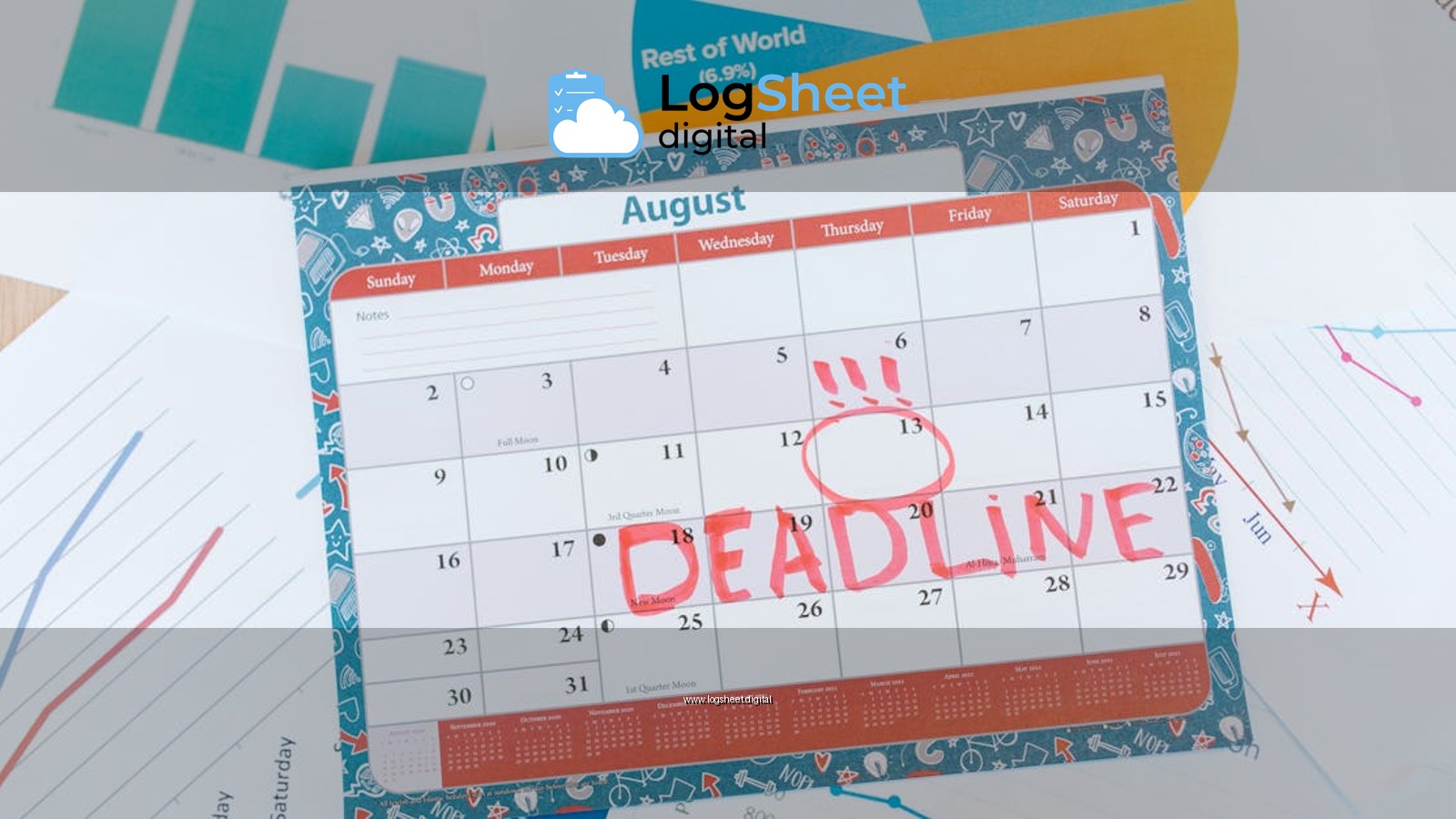 Vibrant August calendar on a desk with deadline marked in red, surrounded by graphs and charts.