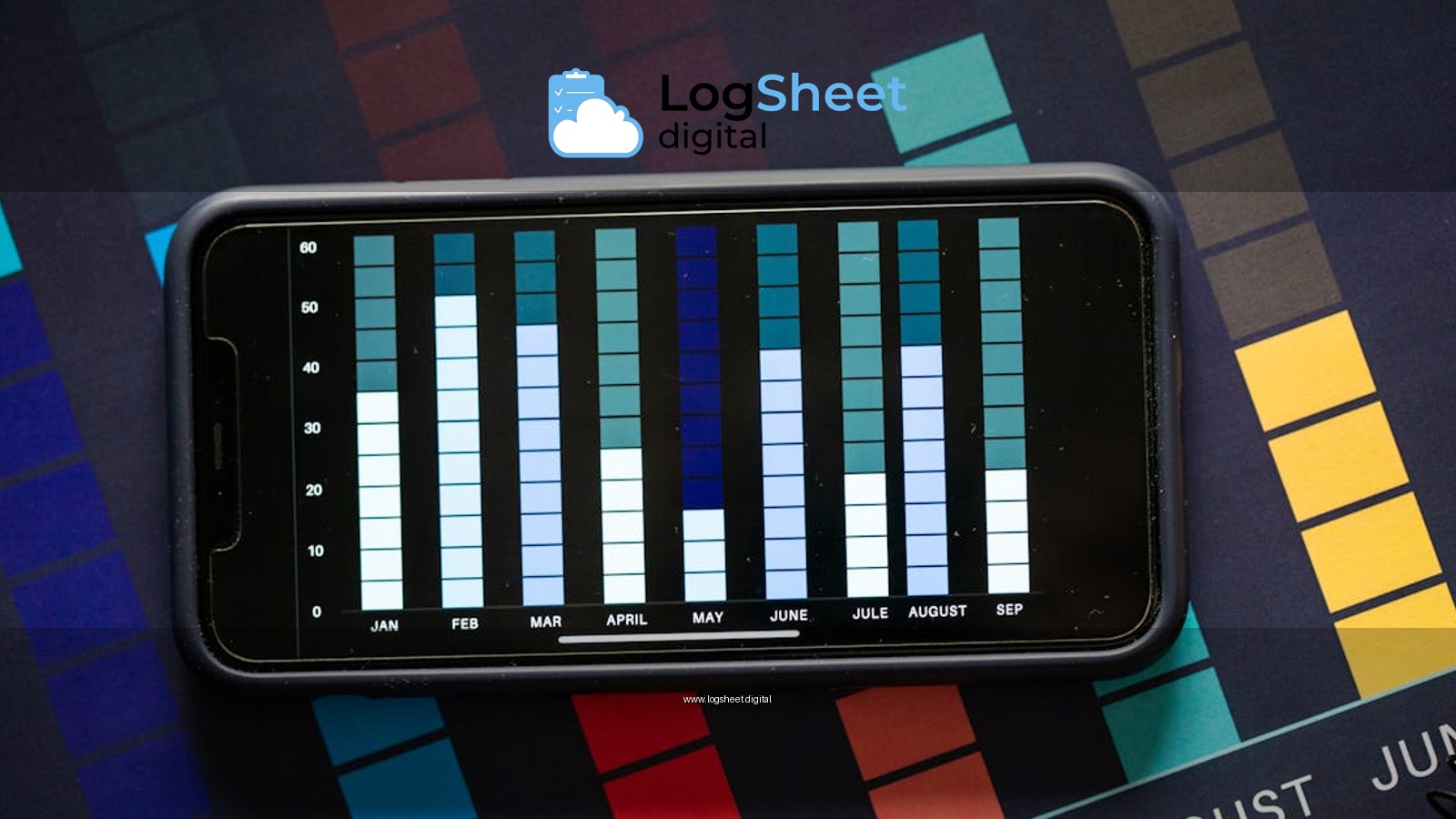 Flat lay of smartphone showing a monthly bar chart against a colorful background, ideal for business analysis visuals.