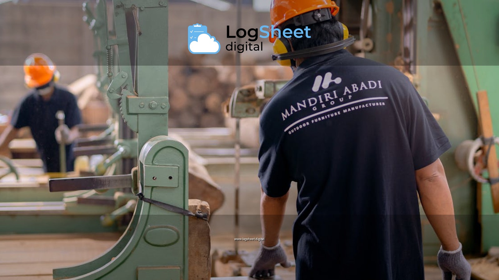 Workers wearing protective gear operating machinery in a factory environment, focusing on safety and production.