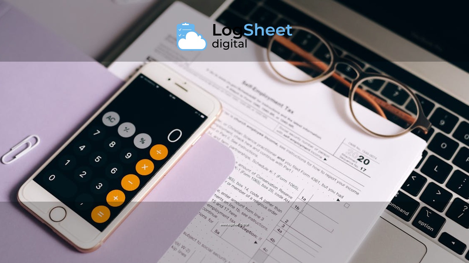 A smartphone with a calculator app on tax documents next to a laptop, emphasizing modern accounting.