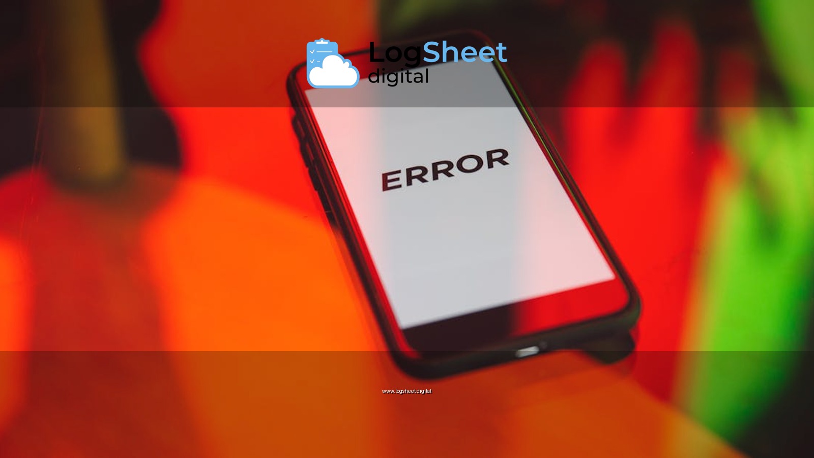 A smartphone displaying an 'ERROR' message surrounded by vibrant red and green reflections indoors.