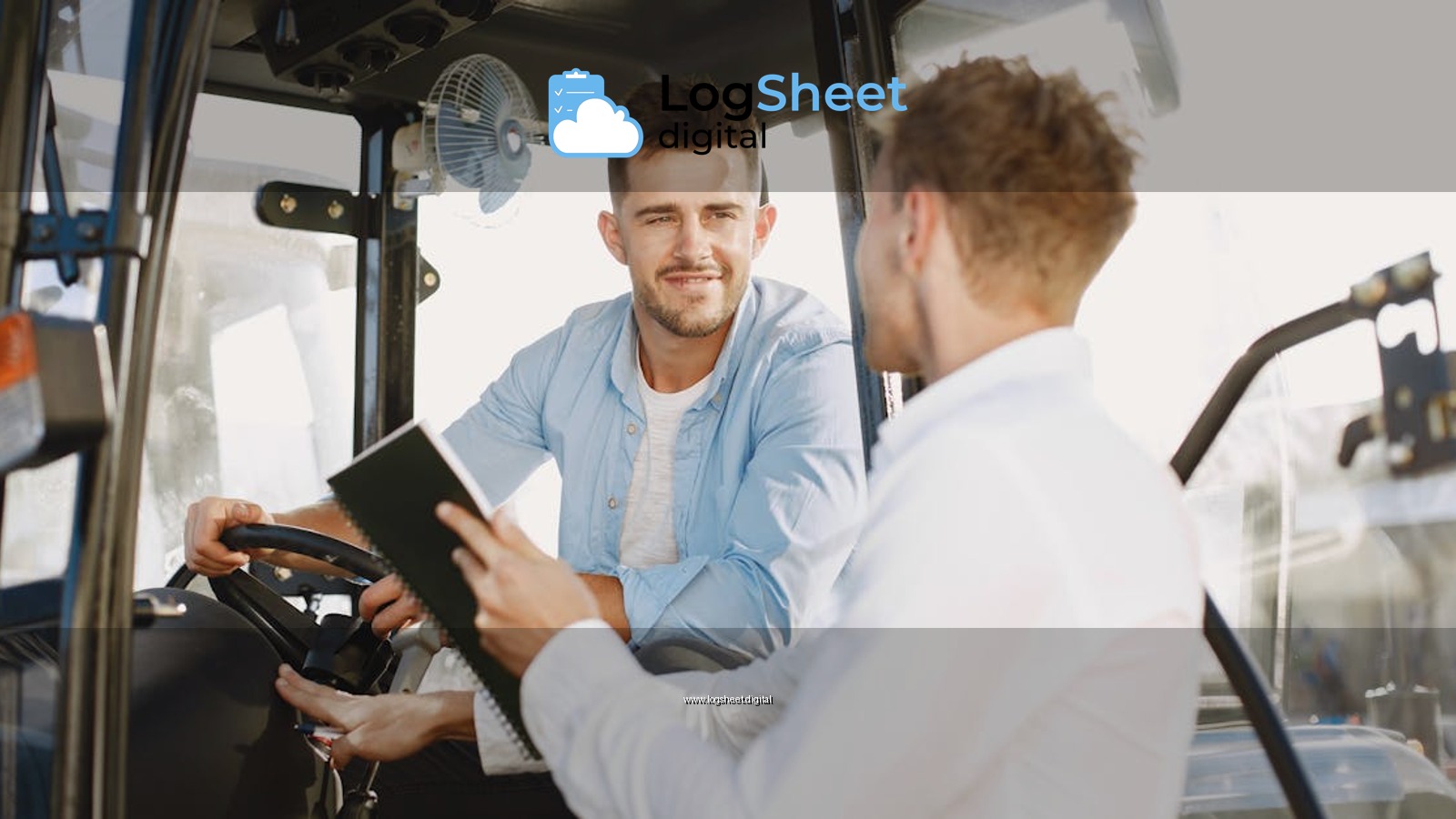 Two men collaboratively discussing inside machinery cabin, fostering teamwork.