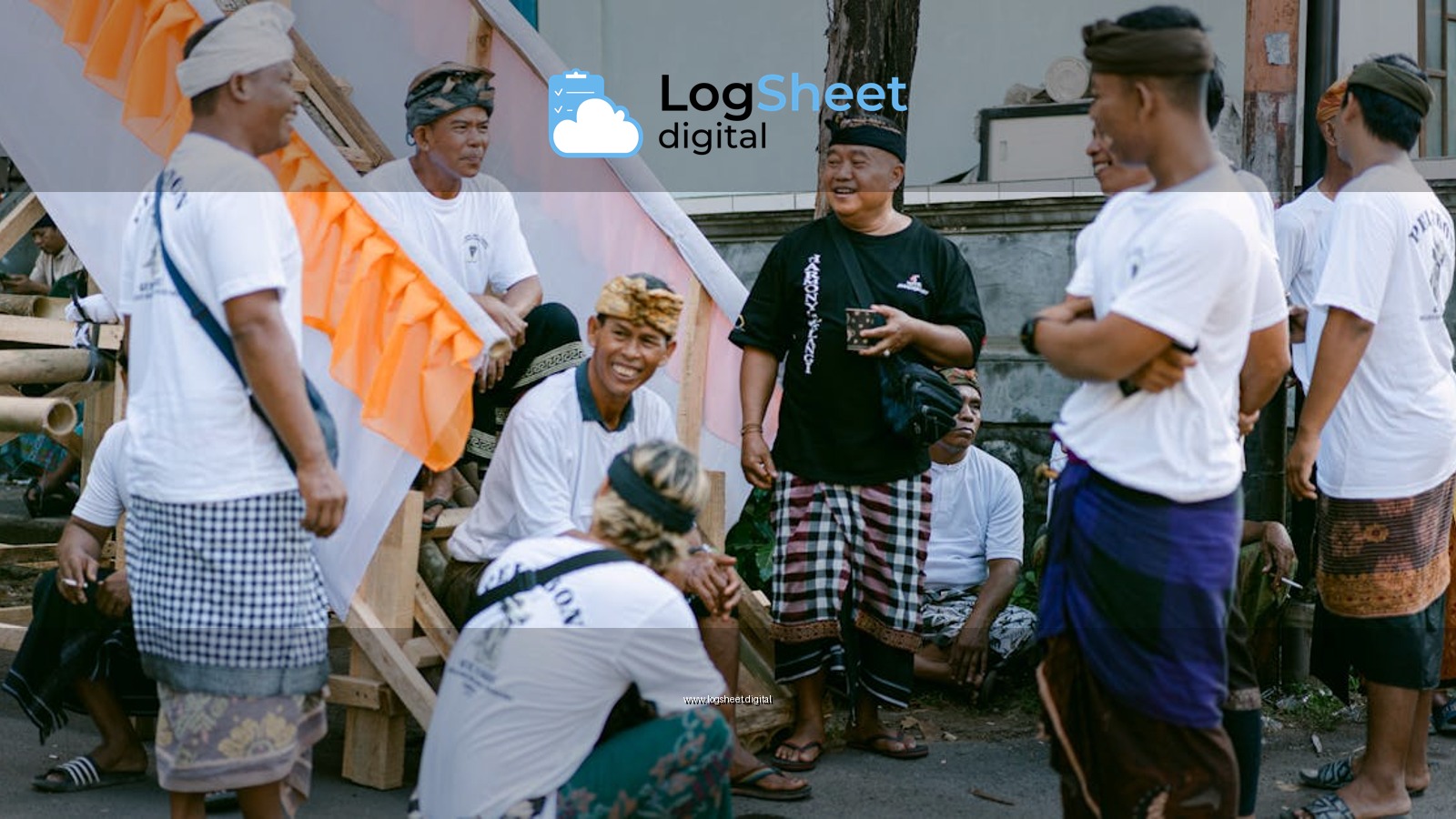 Group of Balinese men socializing outdoors in traditional clothing.