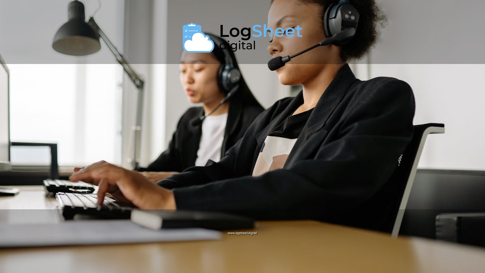 Two call center agents working at desks in an office setting with headsets.