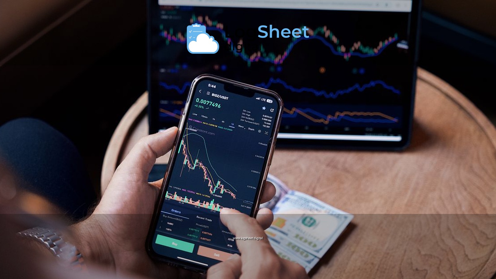 Close-up of a person trading stocks using a smartphone and a tablet.