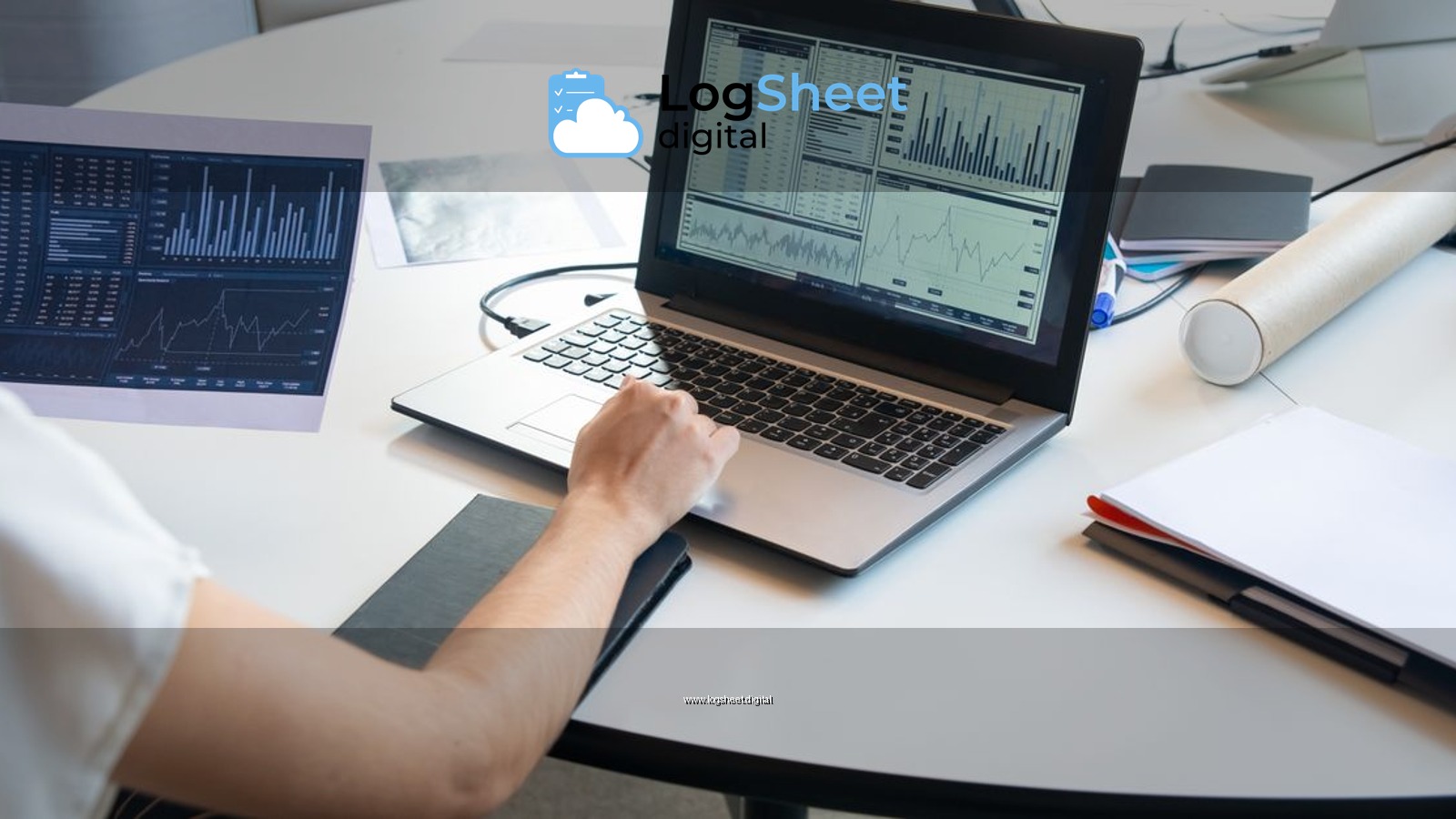 Business person evaluating financial charts on a laptop in a modern office setting.