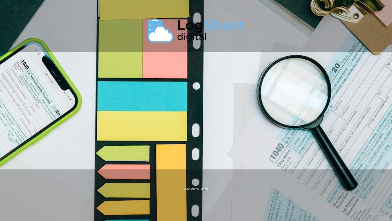 Colorful office supplies with smartphone and magnifying glass on tax forms. Perfect for business and financial themes.