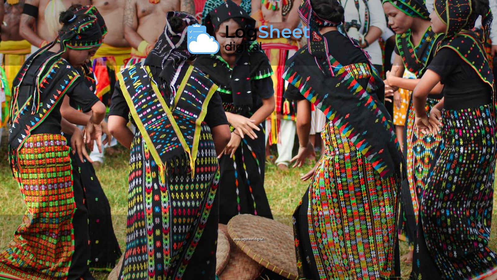 Women in colorful traditional attire perform a lively dance in Badjo, Indonesia.