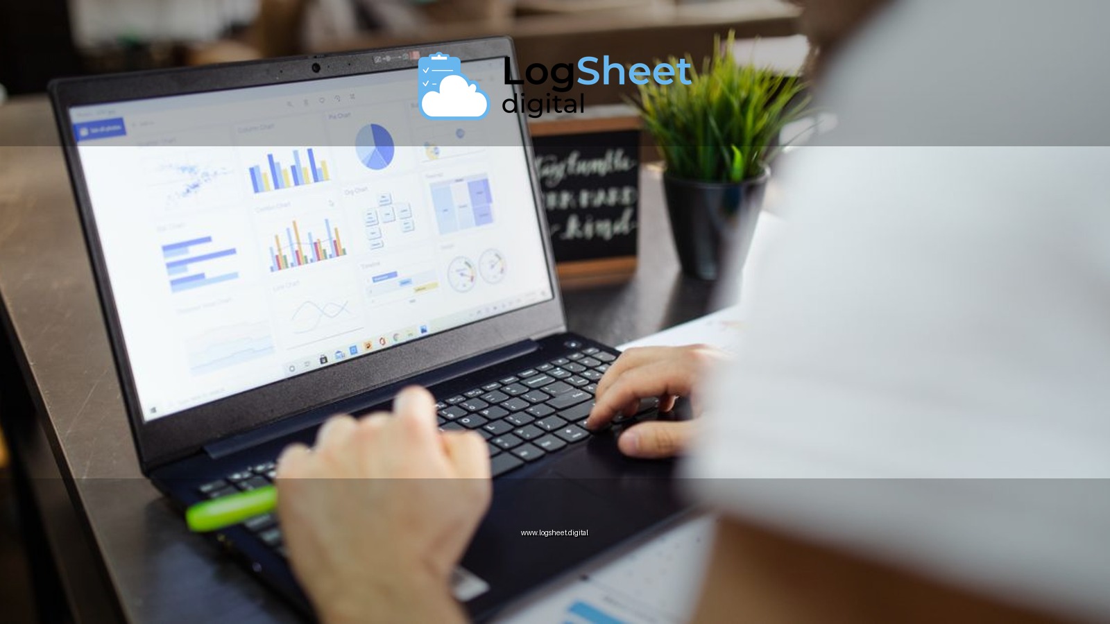 Focused business analysis with charts and graphs on a laptop in a modern office setting.