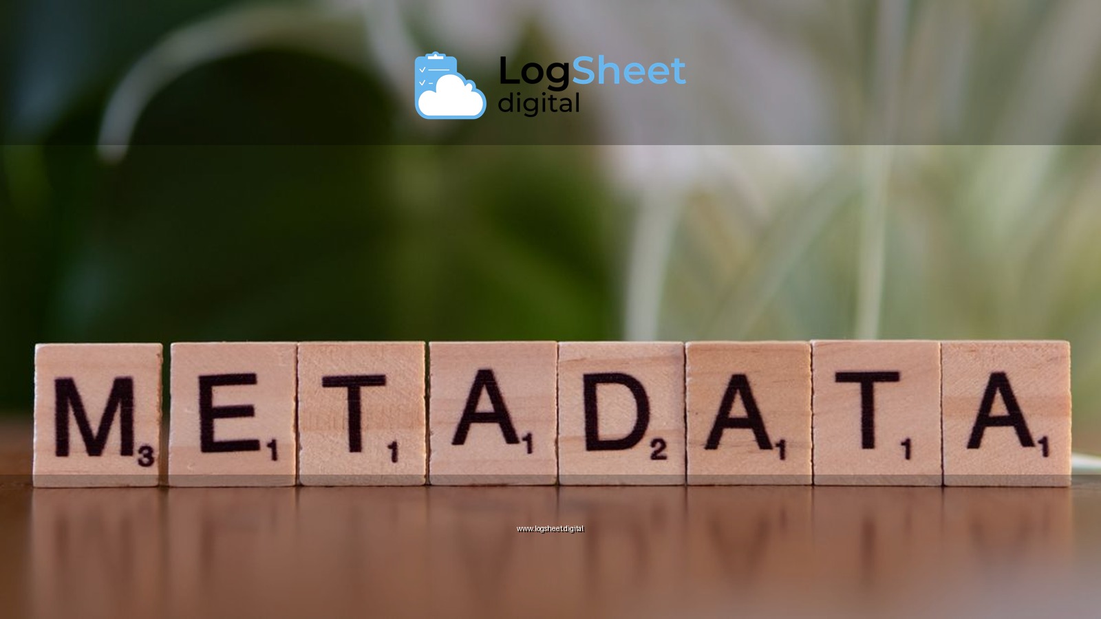 Close-up of the word 'metadata' spelled out with wooden Scrabble tiles on a table.