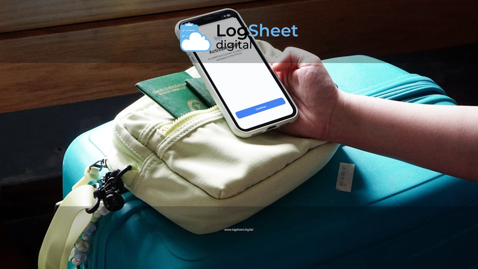 Close-up of a traveler activating eSIM on a smartphone over luggage, ready for a trip.