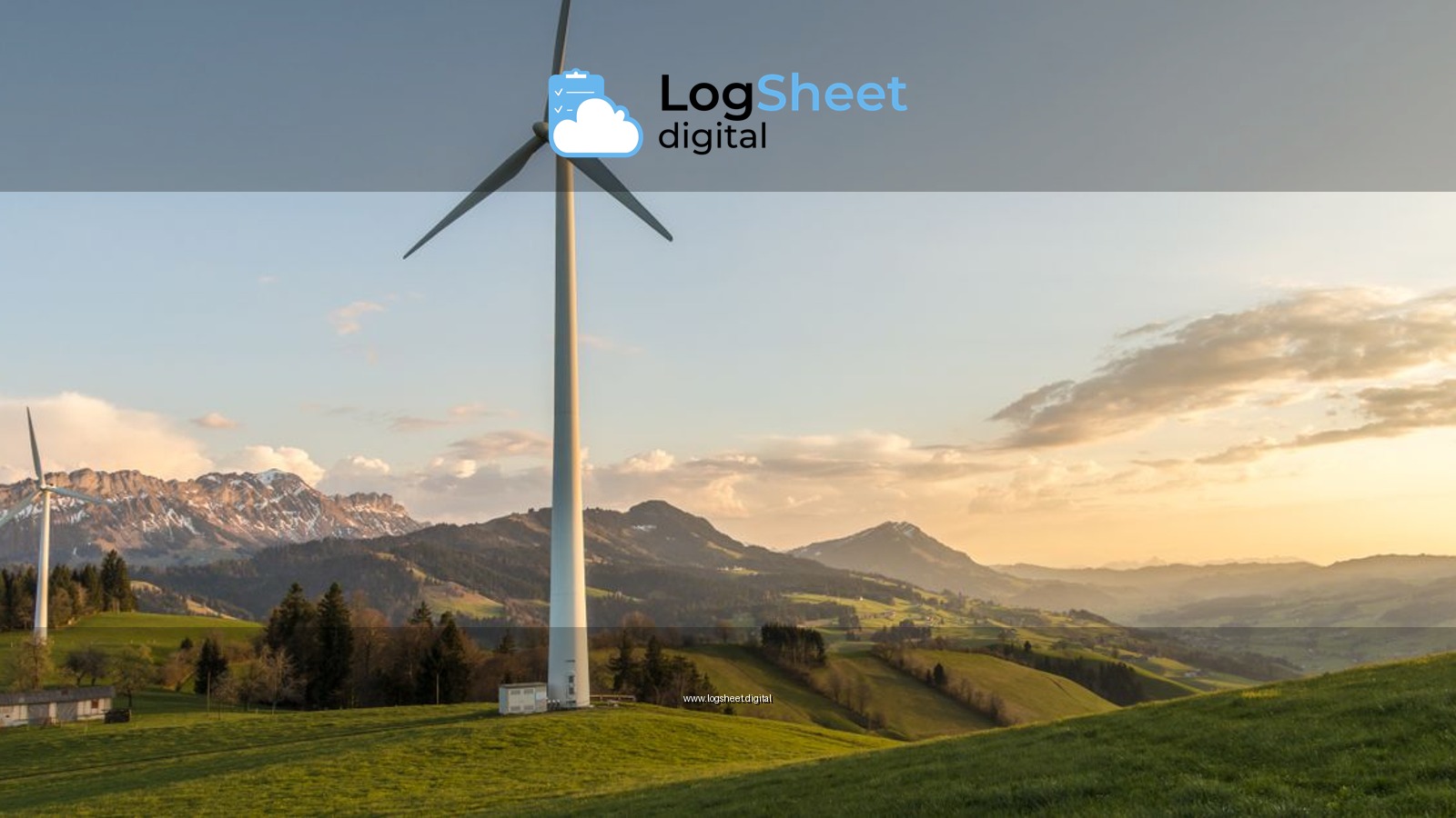 Peaceful countryside with wind turbines during sunset, showcasing sustainable energy.