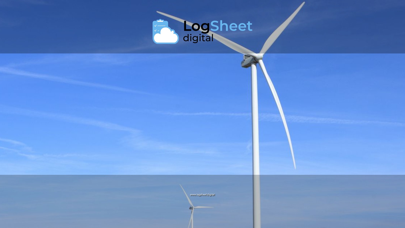 Wind turbines under a clear blue sky symbolize clean energy and sustainability.