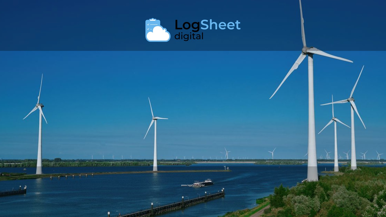 Renewable wind energy turbines standing over water under a clear blue sky in Bruinisse.
