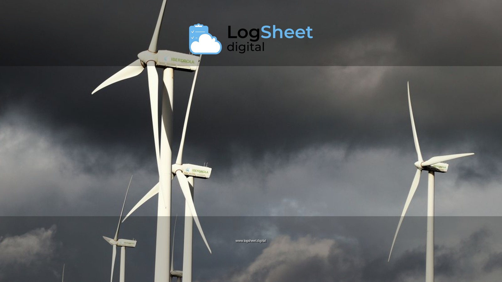 Wind turbines with dark storm clouds in the background, highlighting renewable energy amid powerful weather conditions.