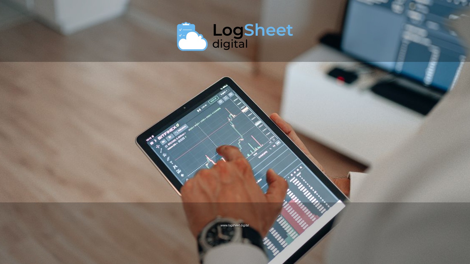A person holding a tablet indoors displaying financial trading graphs, engaging in digital finance analysis.