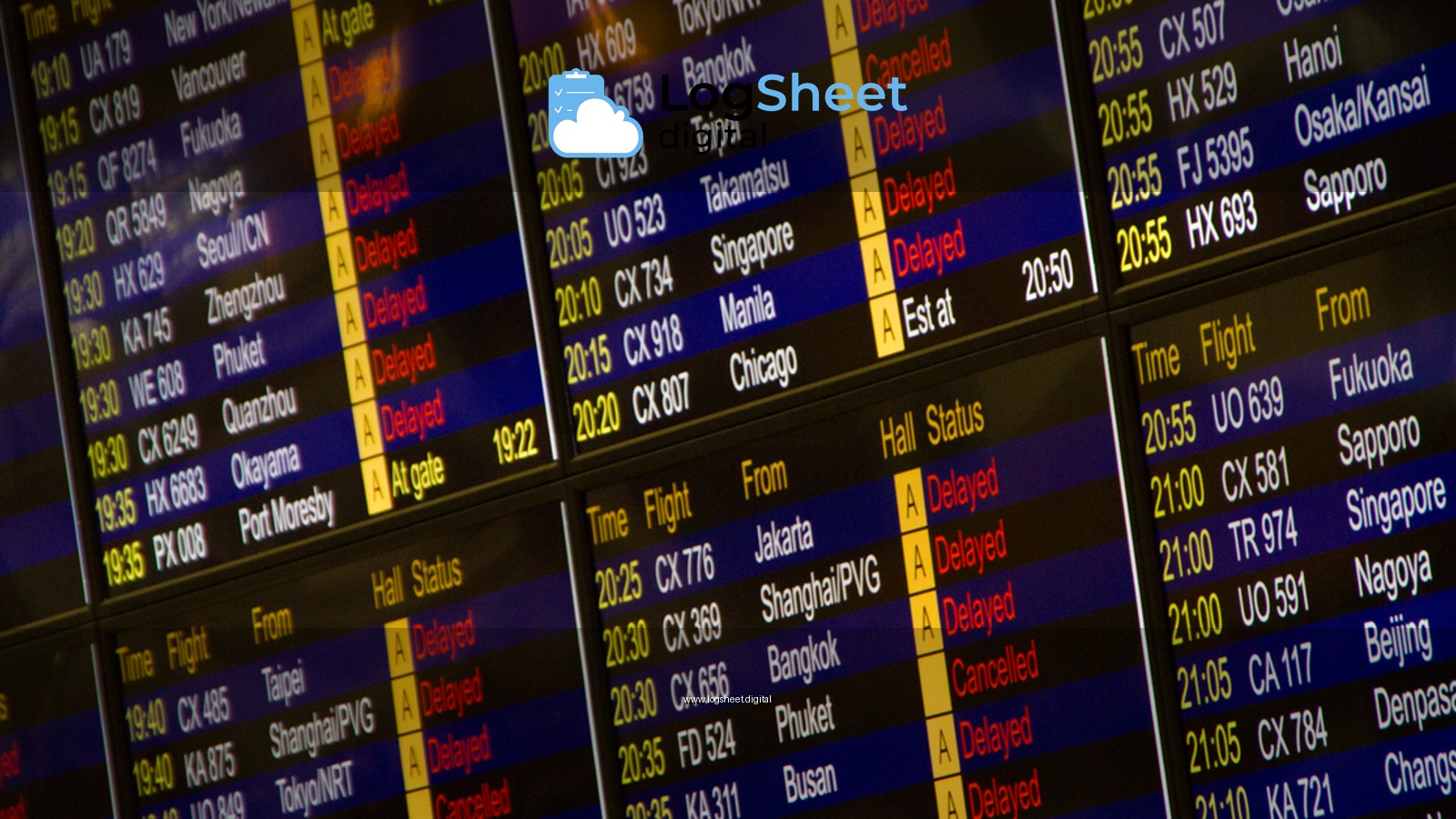 Close-up of digital flight information board showing arrivals and departures at an airport.