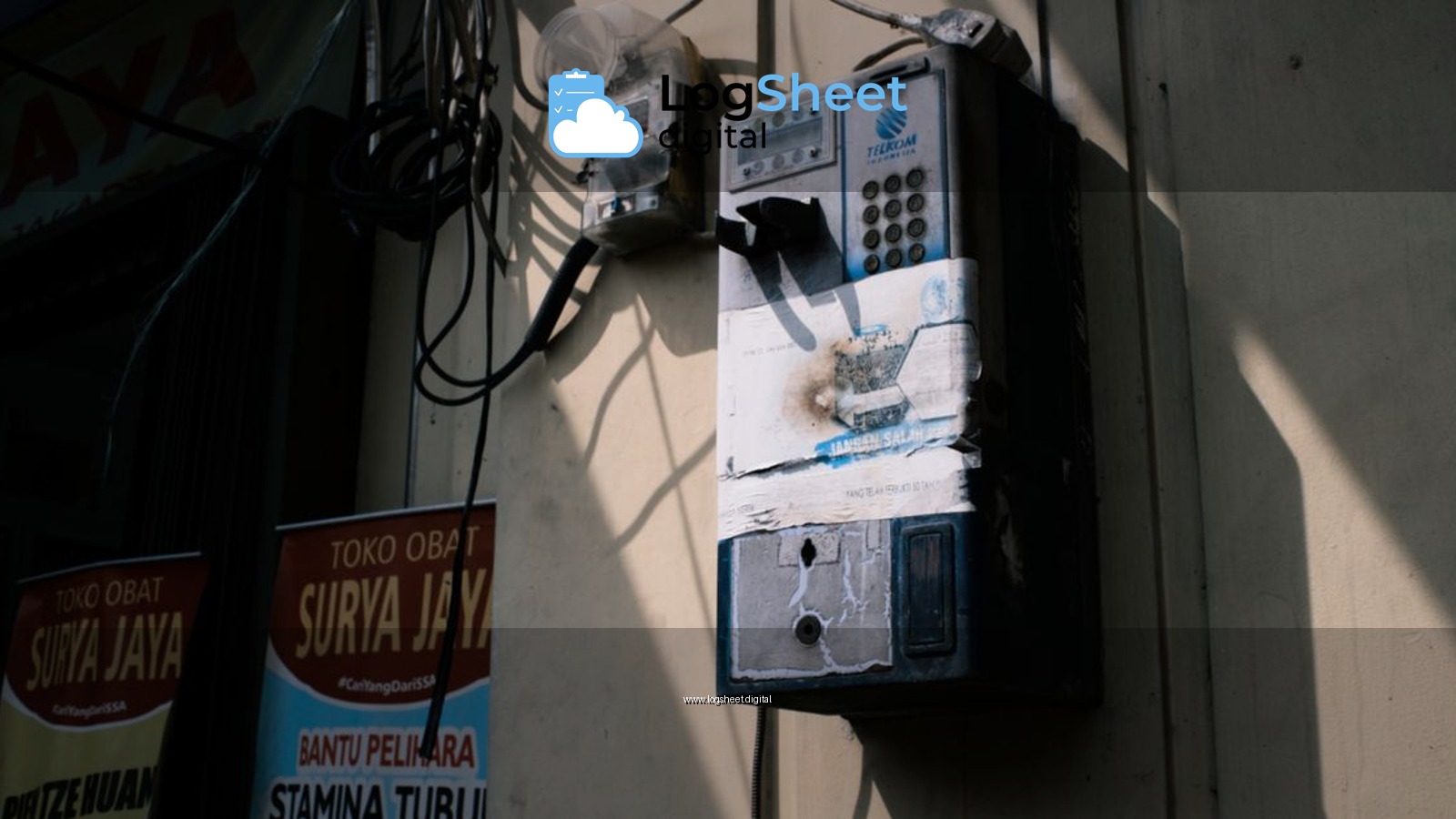 Retro payphone on Jakarta street, capturing urban nostalgia and vintage technology.