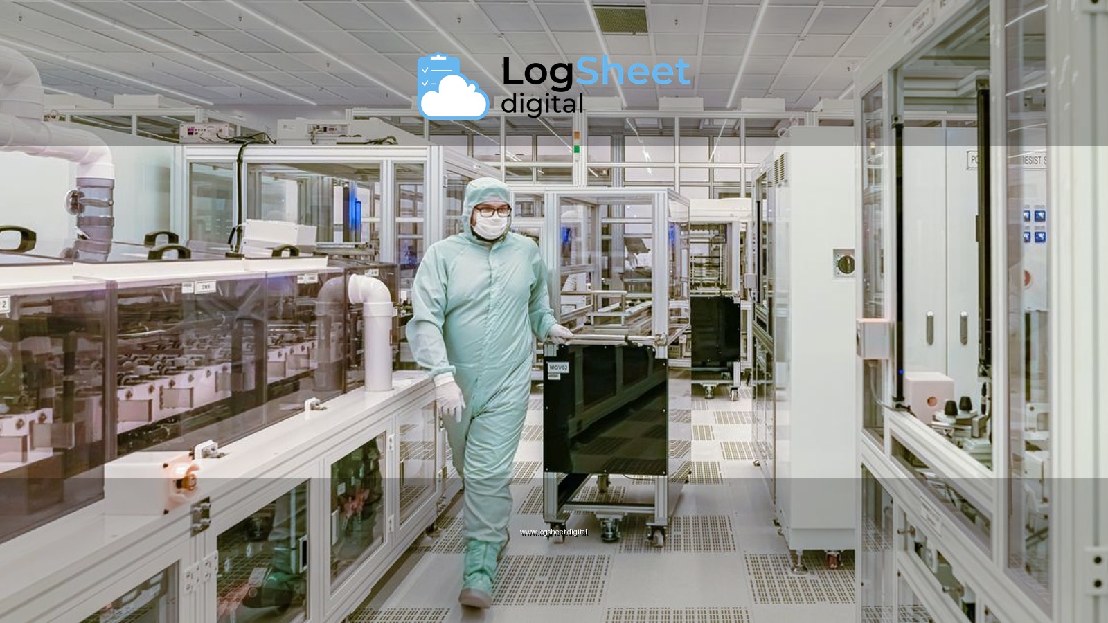 Scientist in protective gear walking in a high-tech cleanroom laboratory environment.