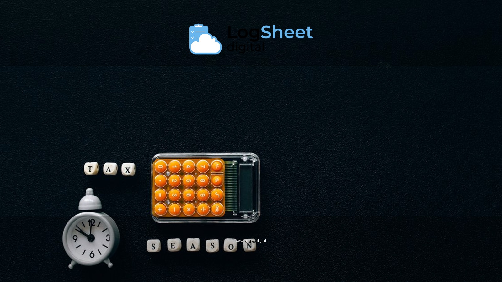 Flat lay of a tax season theme with a clock and calculator on a dark background.