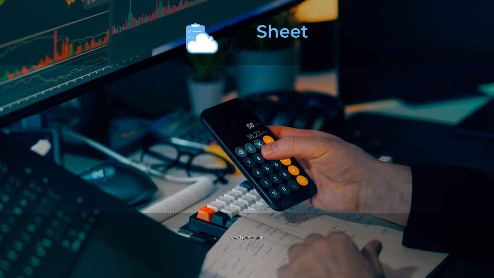 Business analysis with calculator and computer monitor displaying financial graphs and charts.